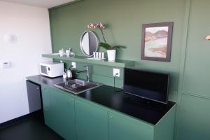 
A kitchen or kitchenette at Abpopa Hillcrest
