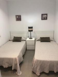 Postel nebo postele na pokoji v ubytování Sweet Apartment Las Canteras