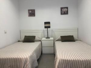Postel nebo postele na pokoji v ubytování Sweet Apartment Las Canteras