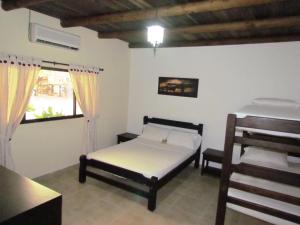 a bedroom with a bed and a table and a window at Tiuma Park in Marsella