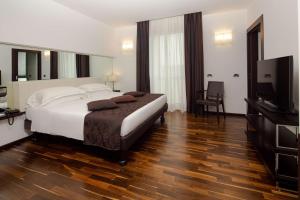 Postel nebo postele na pokoji v ubytování Best Western Hotel Biri