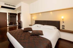 Postel nebo postele na pokoji v ubytování Best Western Hotel Biri