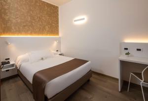 Postel nebo postele na pokoji v ubytování Best Western Hotel Biri