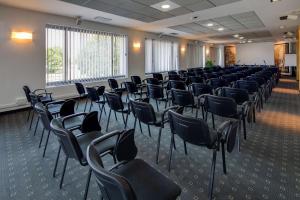 an empty room with chairs in a classroom at Best Western Hotel Biri in Padova
