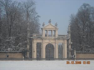a large building with a gate in the snow at Hotel The Click - Art & Colors in Cazzago di Pianiga