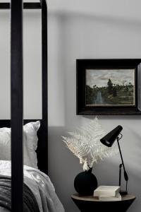 a bed with a picture of a bird on it at The Bower Byron Bay in Byron Bay