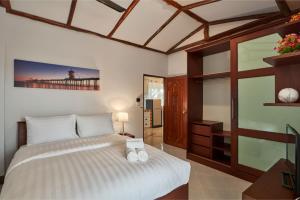 Ένα ή περισσότερα κρεβάτια σε δωμάτιο στο Siam Gala Villa