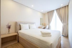 Giường trong phòng chung tại Luxy Park Hotel & Apartments - Notre Dame