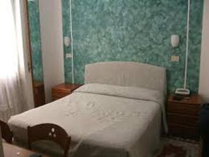 Postel nebo postele na pokoji v ubytování Albergo Villagrande