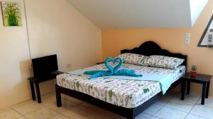 Postel nebo postele na pokoji v ubytování Hotel Sisters Inn