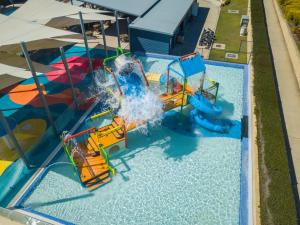 an overhead view of a water park with a water slide at Ingenia Holidays Lake Conjola in Conjola