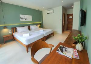 Postel nebo postele na pokoji v ubytování Mini House Aonang Hotel SHA Plus