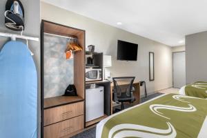 a hotel room with a bed and a desk at Quality Inn Downtown - near Market Square in San Antonio