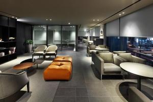 a waiting room with chairs and tables and a lobby at Shilla Stay Seocho Gangnam Station in Seoul