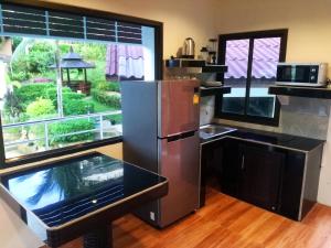 Kuchyň nebo kuchyňský kout v ubytování Koh Samui Palm View Villa