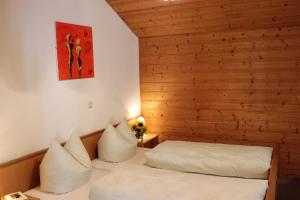 Postel nebo postele na pokoji v ubytování Haus Simma