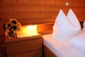 Letto o letti in una camera di Haus Simma