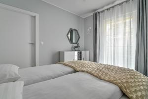 Posteľ alebo postele v izbe v ubytovaní Małe Orłowo LTC - Apartments