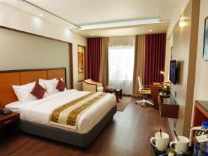Dimora Hotels And Resorts客房内的一张或多张床位