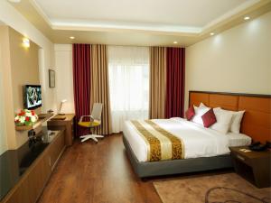 Dimora Hotels And Resorts客房内的一张或多张床位