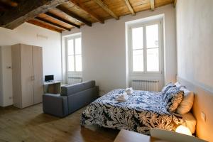 Postel nebo postele na pokoji v ubytování Conte Durini Apartments & Rooms