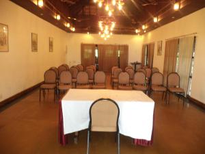 a conference room with a white table and chairs at Punnamada Resort in Alleppey +37 photos