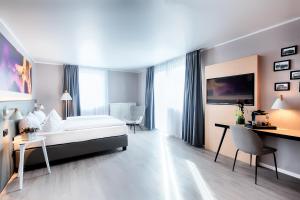 Postel nebo postele na pokoji v ubytování Offenbach Plaza Hotel