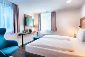 ACHAT Hotel Stuttgart Zuffenhausen 객실 침대