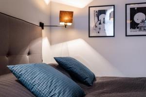 Posteľ alebo postele v izbe v ubytovaní 3D WYGODA Apartamenty