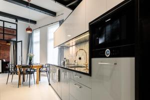 Kuchyňa alebo kuchynka v ubytovaní 3D WYGODA Apartamenty