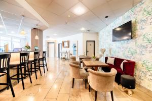 ACHAT Hotel Stuttgart Zuffenhausen TV 또는 엔터테인먼트 센터