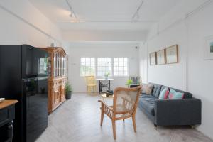 a living room with a couch and a table at Blu Monkey Boutique Phuket Town in Phuket
