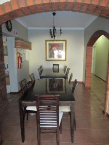 a dining room with a table and chairs at faces guesthouse in Bethlehem