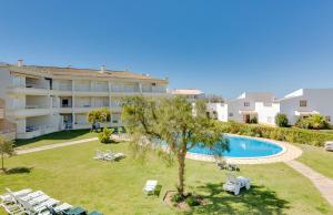 an apartment with a swimming pool and a resort at Falésia II - Nice Apartment - Vilamoura in Vilamoura