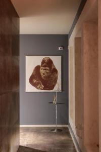 a painting of a woman on a wall in a room at Neko Boutique Hotel in Cagliari
