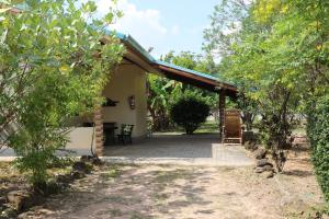 an outside view of a house with a patio at EiDI Homestay in Nong Kung Si