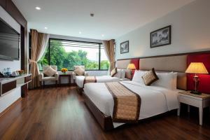 Voodi või voodid majutusasutuse Skylark Hotel toas