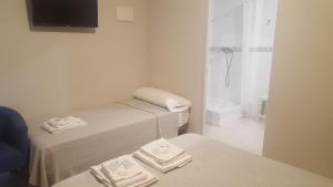 Postel nebo postele na pokoji v ubytování Hotel Castellverd