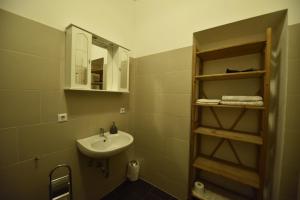 a bathroom with a sink and a mirror at Ferienwohnung Villa Weyermann in Leichlingen +117 photos