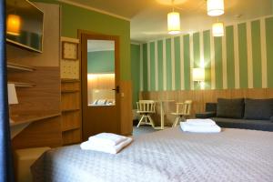 Postel nebo postele na pokoji v ubytování Alba Hotel