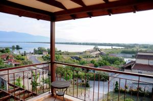 a balcony with a view of the water at Guesthouse To Fragma in Lithótopos