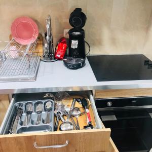 a drawer in a kitchen with utensils at Duplex in Antwerp