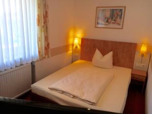 Postel nebo postele na pokoji v ubytování Hotel Ebnet
