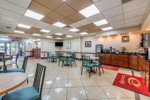 a large kitchen with a dining room table and chairs at Econo Lodge Downtown Louisville in Louisville