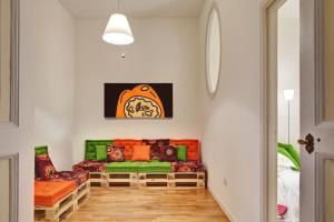 a living room with a couch in a room at Hotel Piazza Bellini & Apartments in Naples