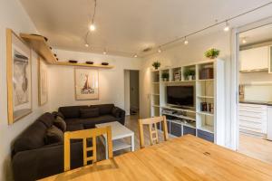 a living room with a couch and a table at Apartment Gentianes 1 in Chamonix-Mont-Blanc