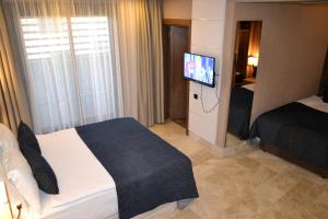 Postel nebo postele na pokoji v ubytování Extenso Hotel