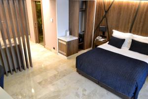 Postel nebo postele na pokoji v ubytování Extenso Hotel