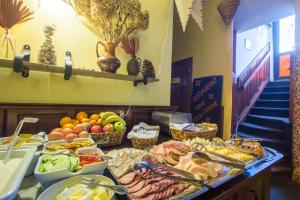 a buffet with many different types of food on a table at Hotel Klarinn Prague Castle in Prague