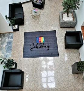 an overhead view of a rug with the word gardening on it at Das Schärding in Schärding